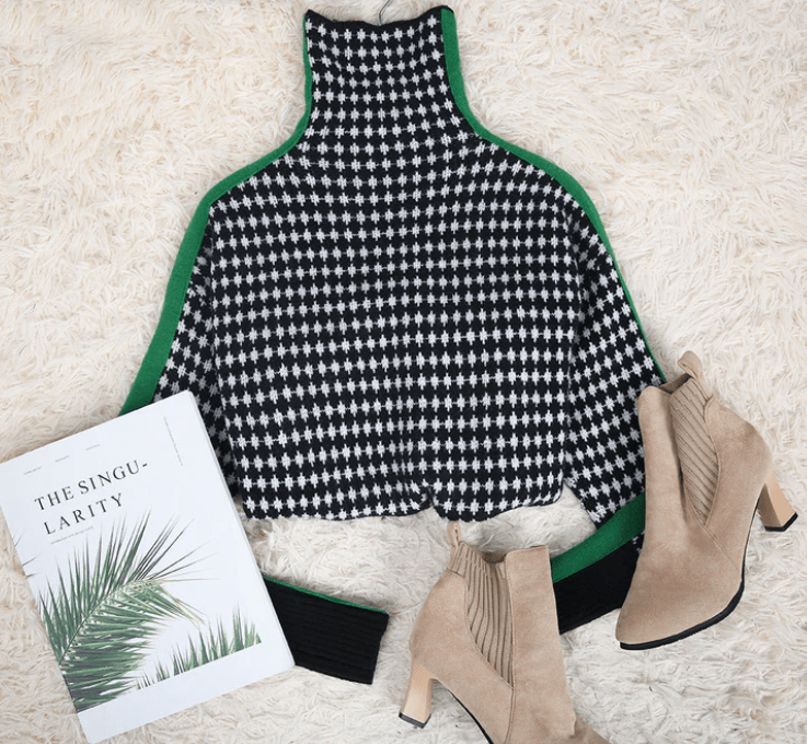 CM | Elegante jersey con estampado de cuadros blancos y negros